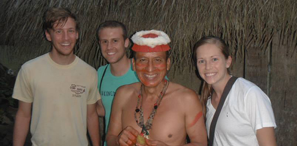 Pharmacy student Christopher Terry (left), health sciences student John Wright Polk IV and pharmacy student Brette Hogan posed with a Tsáchilas community member in Ecuador.