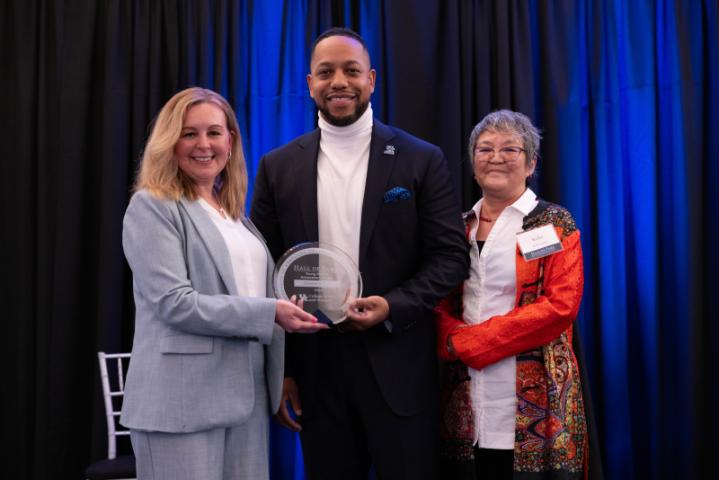 Award winner poses with Dean Ana and 