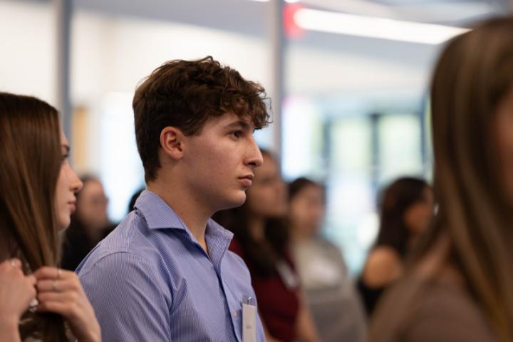 A student listens to the panel