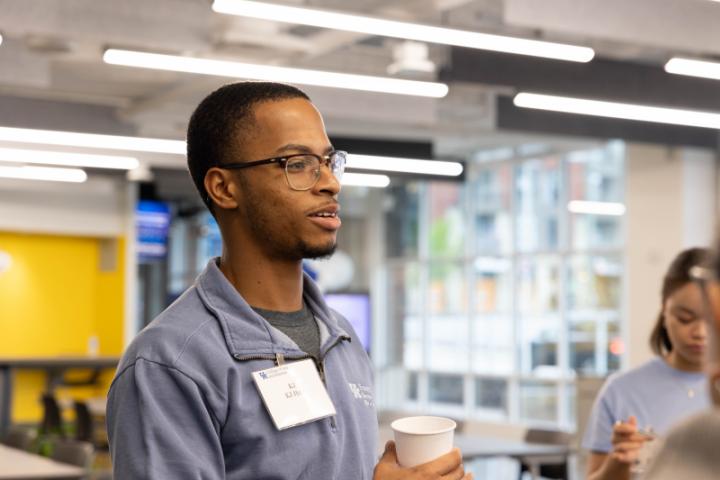 A student mingling with a group