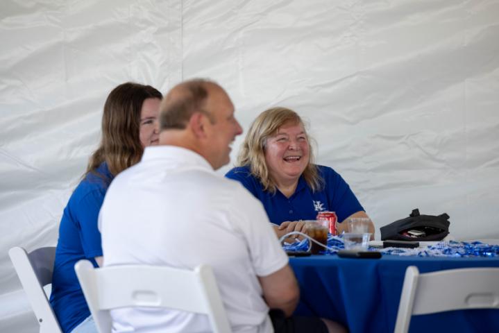 Alumni sitting and talking at an event