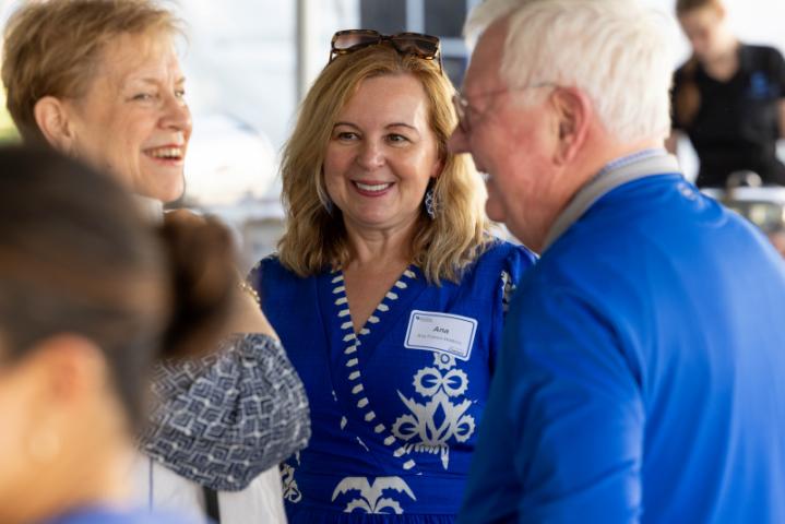 dean ana and alumni talking