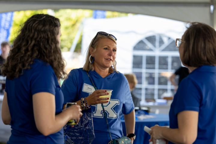 group of alumni chatting at tailgate