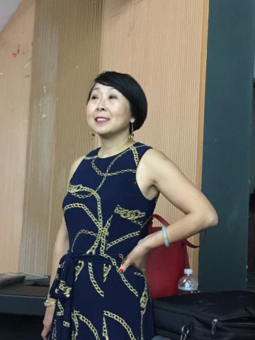 Huajing Maske speaking at SICFL.