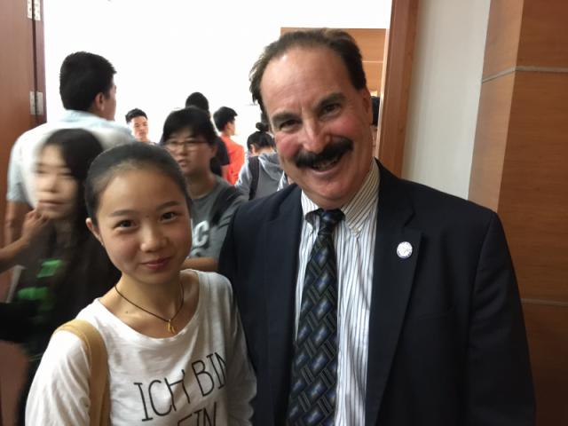 Dean Kornbluh with a German major at Shanghai Institute of Technology.