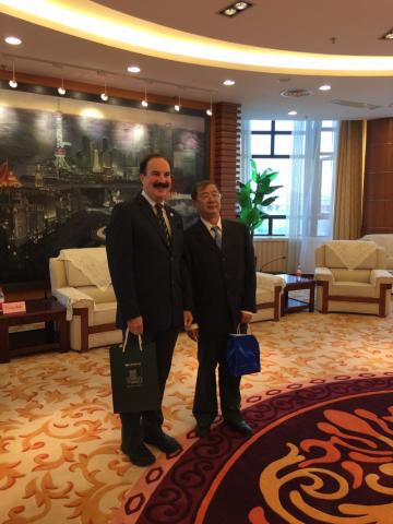 Dean Mark Kornbluh with the president of the Shanghai Institute of Technology.