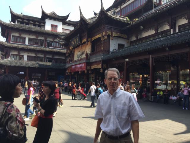 Tom Clayton in the commercial area outside Shanghai Yuyan Garden.