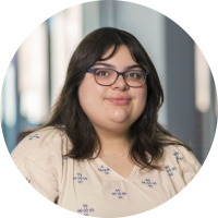 Mia Peek in a white and blue blouse