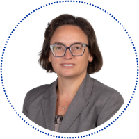 Hannah Haksgaard in a grey suit jacket.