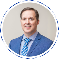 William "Barry" Lee in a blue suit jacket and blue tie.