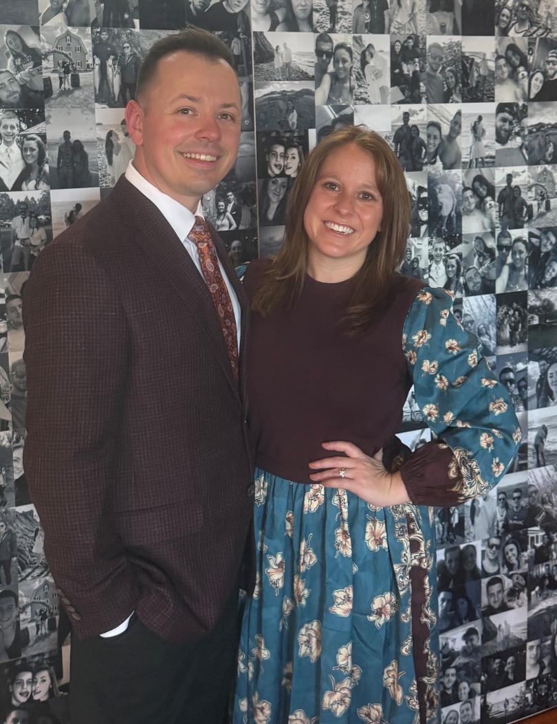 photo of a man and woman in front of photos